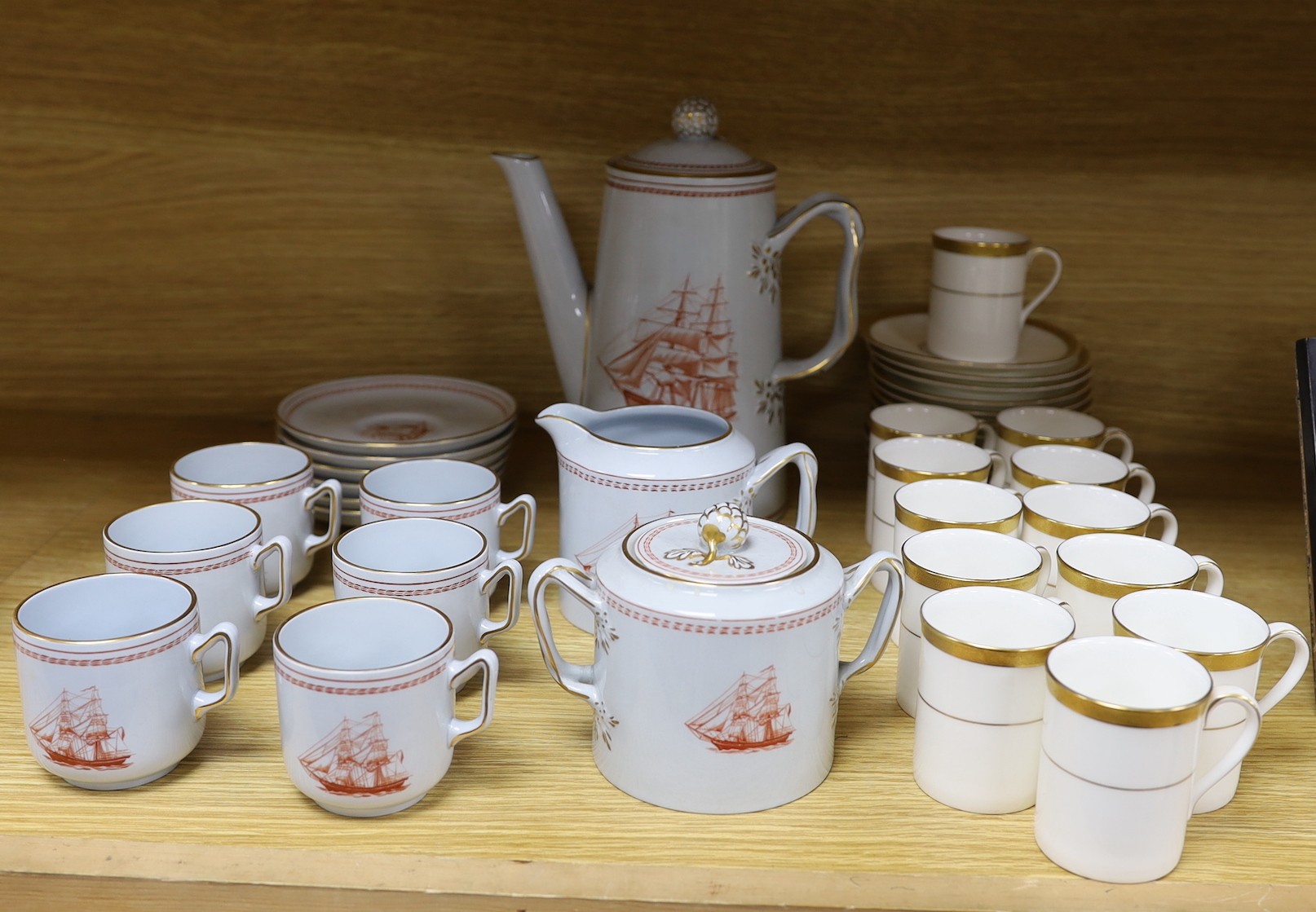 A Copeland fifteen piece coffee service, Trade Winds pattern, and a Doulton Royal Gold pattern coffee set